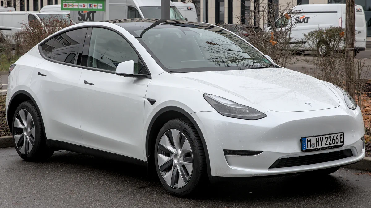 A Tesla Model Y parked on a street in Stuttgart-Vaihingen, photographed from a three-quarter front view.